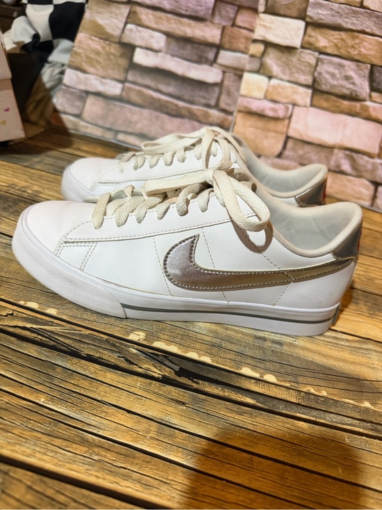 Nike Shoes - Nike Women's White Sneakers with Metallic Silver Swoosh